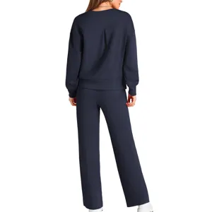 Dark blue knit tracksuit set featuring a long sleeve top and wide leg pants for women.