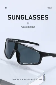 Close-up detail of black frame cycling sports sunglasses with dark UV-protection shield lens.