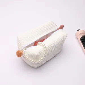 White waffle cosmetic bag with pearl handle and bow, large capacity travel makeup pouch.