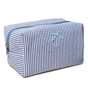 Blue and white striped cosmetic bag with cute bow zipper travel makeup pouch for daily use.
