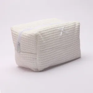 White waffle cosmetic bag with cute bow, large capacity portable travel makeup storage pouch.