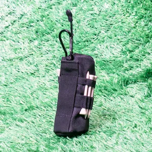 Golf pouch detail showing durable black nylon material with carabiner and tee holders.