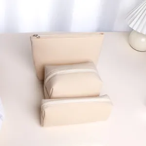 Beige corduroy makeup bag detail, portable toiletry pouch close-up, neat zipper storage design.