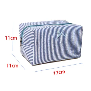 Blue and white striped cosmetic bag with zipper and cute bow, 17x11x11cm toiletry pouch.