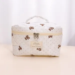 Quilted cosmetic bag with cute bear pattern, large capacity travel toiletry pouch detail.