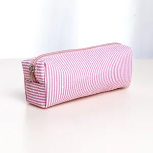 Pink and white striped pencil case, portable makeup pouch with smooth zipper closure.
