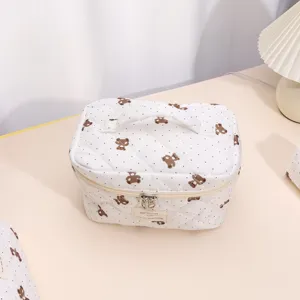 Quilted cosmetic bag with cute bear pattern, large capacity travel makeup pouch for women.