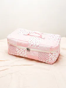 Pink quilted patchwork cosmetic bag portable travel storage makeup case detail view