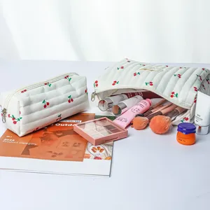 Quilted cosmetic bag detail featuring adorable cherry print, soft cotton fabric and smooth zipper.
