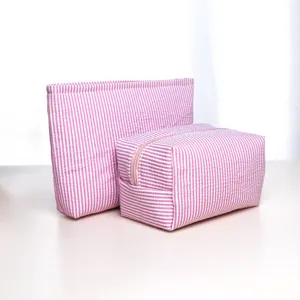 Pink striped cosmetic bag set detail view, portable travel storage pouch with zipper.