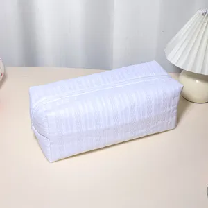 White quilted striped zipper storage bag for hair styling tools and cosmetics, portable.