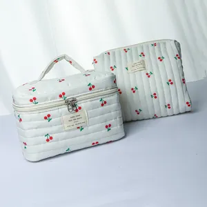 Quilted cosmetic bag set with cute cherry print, large capacity portable toiletry travel pouch.