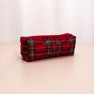 Red plaid quilted cosmetic pouch detail, portable travel makeup storage bag for women and girls.