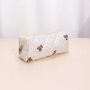 Detailed view of the quilted makeup pouch featuring cute bear prints and smooth zipper.