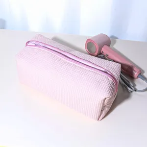 Pink waffle hairdryer storage bag, portable large capacity organizer travel cosmetic pouch.