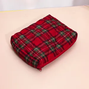Red plaid quilted cosmetic bag detail view, perfect for travel storage and makeup organization.