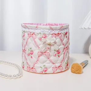 Quilted bow lace storage basket detail showing pink floral fabric, cute balletcore design.