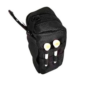 Close-up detail of black nylon golf storage pouch featuring zipper and portable tees slots.