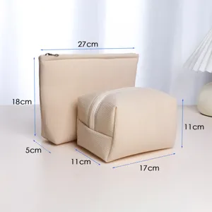 Detailed shot of beige corduroy cosmetic pouch set with clear dimension measurements for travel.
