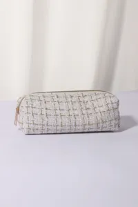 White tweed cosmetic bag with gold threading, compact travel makeup pouch and storage organizer.