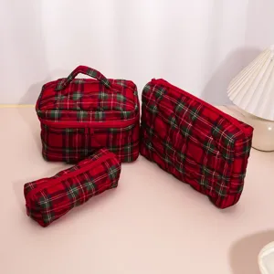 Quilted plaid cosmetic bag set, portable travel makeup organizer and storage pouch details.