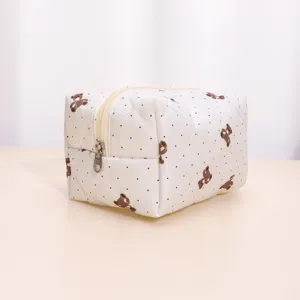 Quilted cosmetic bag with cute bear and polka dot pattern, large capacity zipper travel pouch.