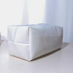 White waffle textured storage bag, large capacity portable zipper cosmetic and hair tool organizer.