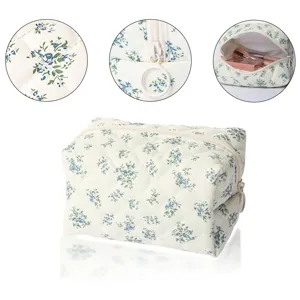 Quilted floral cosmetic bag, large capacity travel makeup pouch with ring zipper pull.