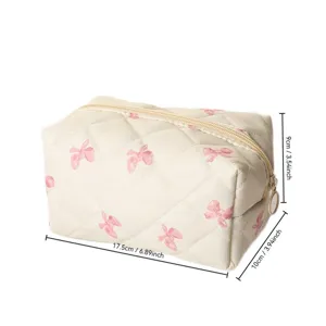 Quilted makeup pouch with pink bow print, large capacity travel cosmetic storage bag for women.