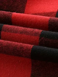 Close up of red and black flannel plaid fabric showing soft texture and clear weave details.