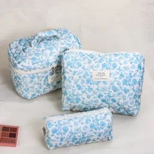 Blue floral quilted cosmetic bag set of three pieces, portable storage pouch for travel.