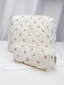 Detail view of quilted floral makeup bag set, soft travel storage cosmetic organizer pouch.