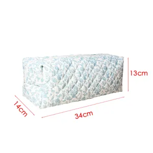 Detailed view of quilted storage bag with blue floral pattern showing product dimensions.