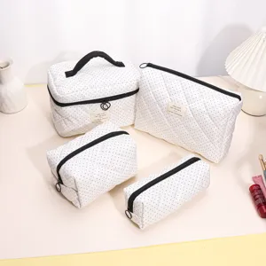 Quilted cosmetic bag set, cute black polka dot travel makeup pouch and portable toiletry storage organizers.