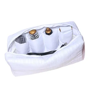 White padded storage bag with multiple compartments designed for hair styling tools and accessories.