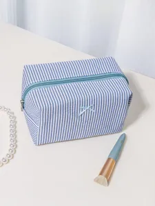 Blue and white striped seersucker cosmetic bag, large travel makeup organizer pouch.