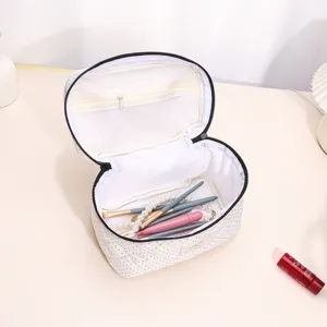 Quilted polka dot cosmetic bag large capacity portable makeup storage pouch for daily travel.