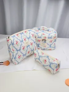 Quilted floral cosmetic bag set, elegant toiletry storage pouch detail view showcase.