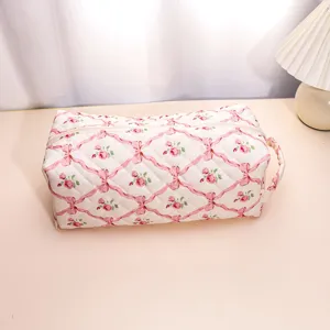 Close-up detail of the quilted floral storage bag featuring soft padding and durable zipper.