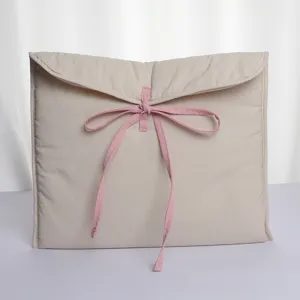 Beige quilted laptop sleeve 14 inch with cute pink bow tie, soft padded tablet bag.