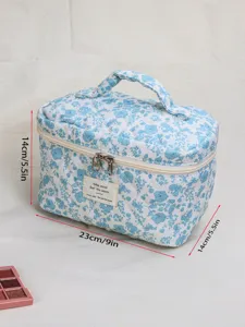 Quilted blue floral cosmetic bag with handle, large capacity portable makeup organizer pouch.
