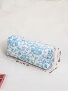 Quilted blue floral makeup bag, large capacity travel cosmetic pouch with zipper closure.