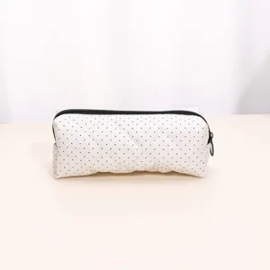 White quilted cosmetic bag with black dots, large capacity portable storage pouch for travel.