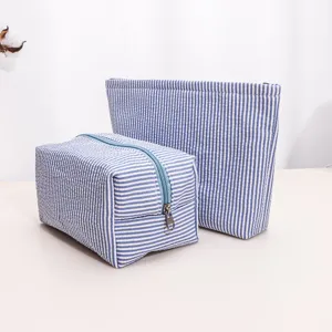 Blue and white striped cosmetic bag set, portable zipper travel wash storage pouch detail.