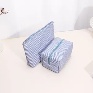 Striped cosmetic travel storage bag set, portable wash pouch, durable zipper organizer detail.