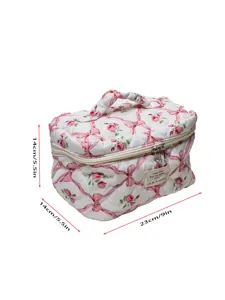 Quilted floral cosmetic bag with bow pattern, large capacity portable travel makeup storage.