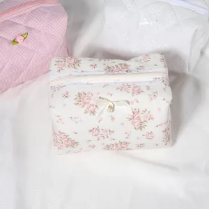 Quilted floral cosmetic bag with lace bow travel toiletry pouch makeup storage bag.