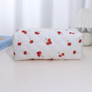 White quilted cosmetic and hair tool storage bag with cute red cherry pattern for daily use