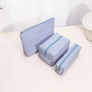 Blue and white striped storage bag set, portable zipper cosmetic and toiletry organizer pouch.