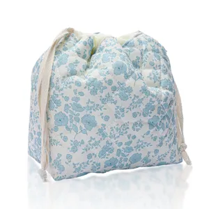 Quilted drawstring makeup bag, cute blue floral travel cosmetic storage pouch, 3D design.